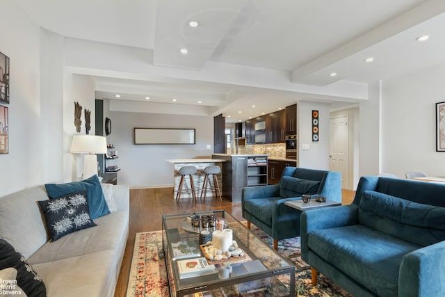 living room with light wood-style flooring, recessed lighting, and baseboards