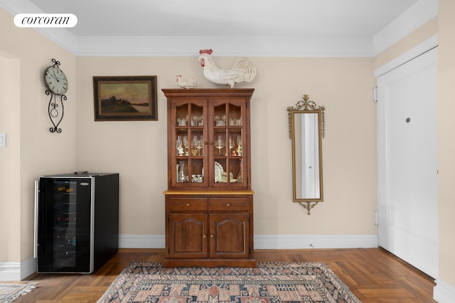 dining room featuring beverage cooler, visible vents, and baseboards