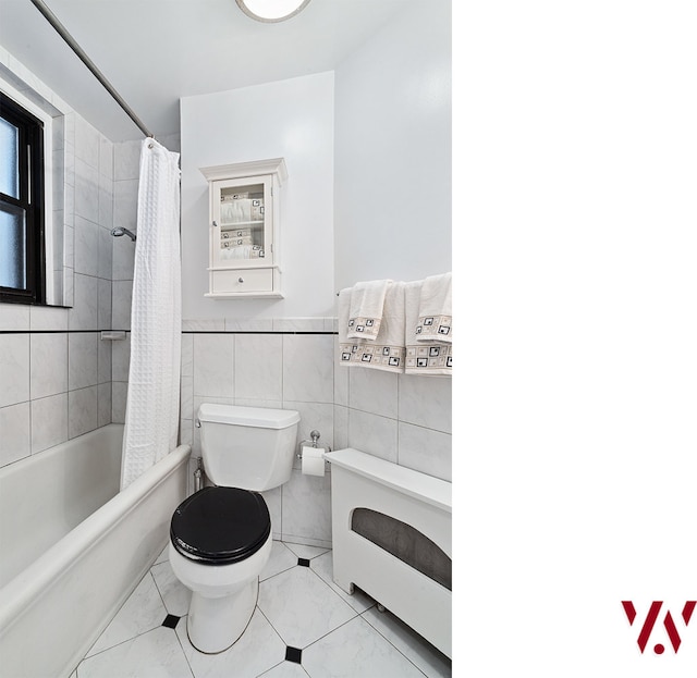 bathroom with tile walls, toilet, and shower / tub combo with curtain