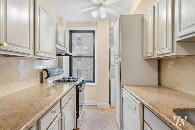 kitchen featuring baseboards, light tile patterned flooring, black range with gas stovetop, dishwasher, and backsplash