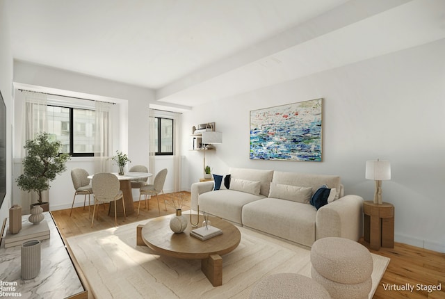 living room with light wood-style floors and baseboards