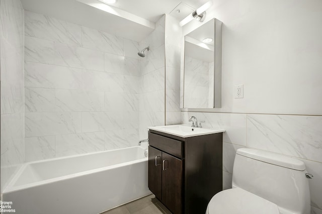 full bathroom featuring toilet,  shower combination, tile walls, and vanity