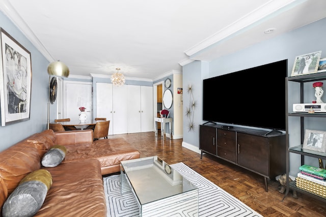 living room with ornamental molding, a notable chandelier, and dark parquet floors