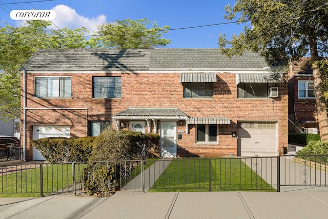 view of front of house with driveway, an attached garage, a front lawn, and brick siding