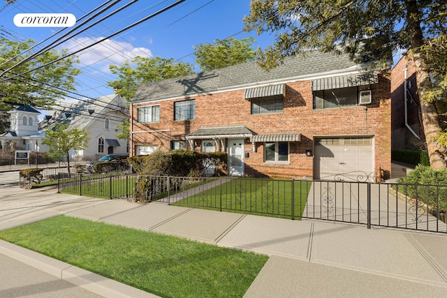 view of front facade featuring concrete driveway, a fenced front yard, roof with shingles, a front yard, and brick siding