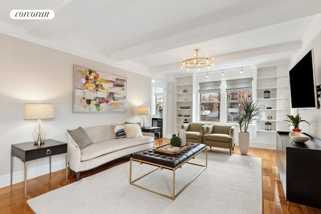 living area with a chandelier, visible vents, baseboards, and built in shelves