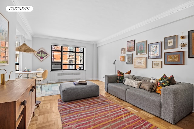 living area with radiator, visible vents, ornamental molding, and baseboards