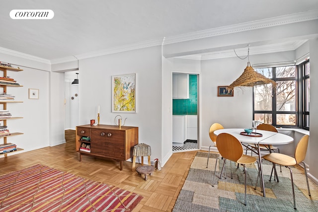 dining room featuring crown molding, visible vents, and baseboards