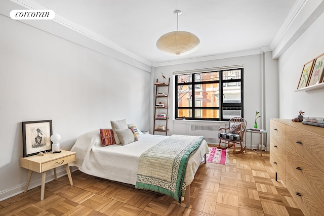 bedroom featuring visible vents, radiator, baseboards, and ornamental molding