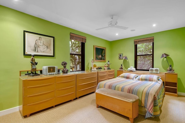 carpeted bedroom with ceiling fan