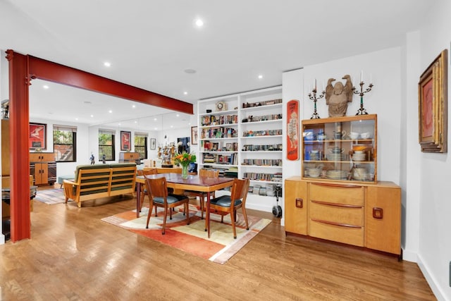 dining space with light hardwood / wood-style floors