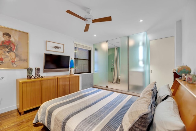 bedroom featuring light hardwood / wood-style flooring and ceiling fan