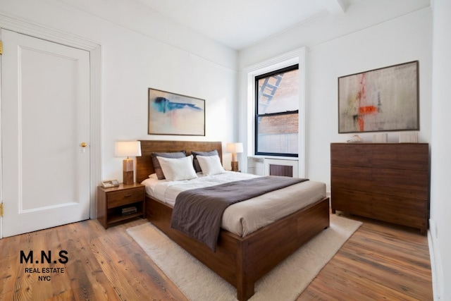 bedroom with wood finished floors