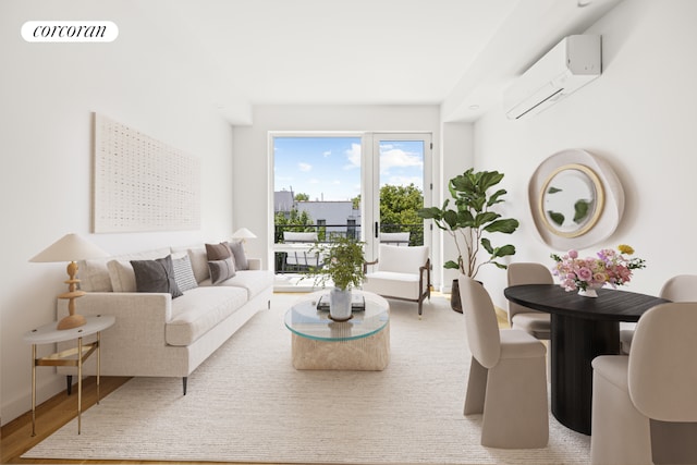 living room featuring hardwood / wood-style flooring and an AC wall unit