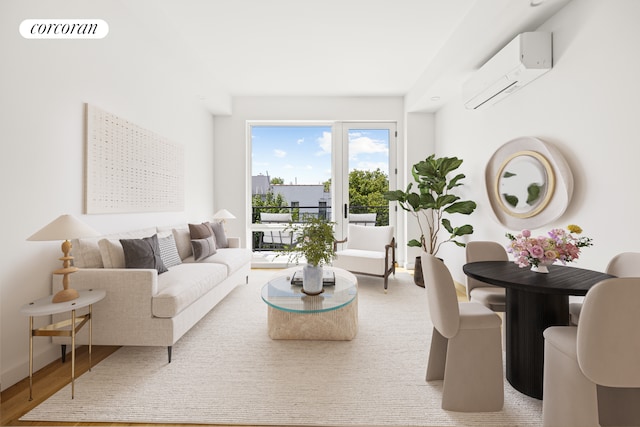 living area featuring baseboards, wood finished floors, visible vents, and a wall mounted AC