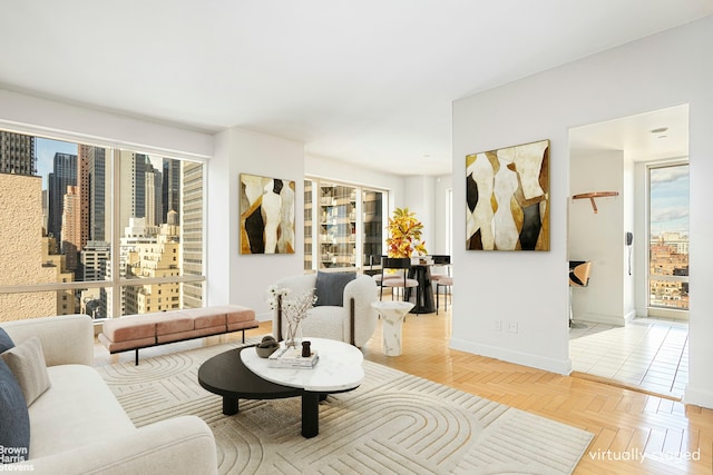 living room with plenty of natural light and baseboards