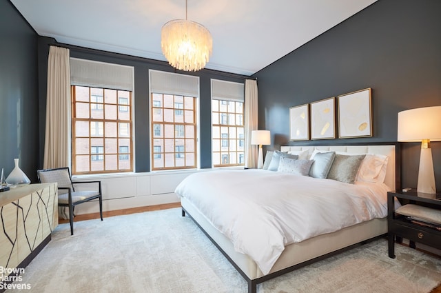 bedroom featuring an inviting chandelier