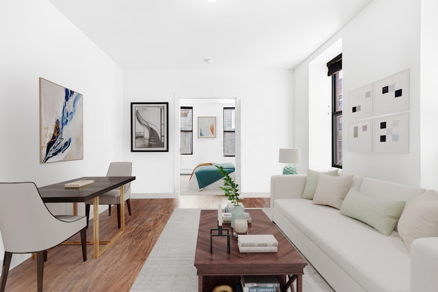 living room with light wood-type flooring and baseboards