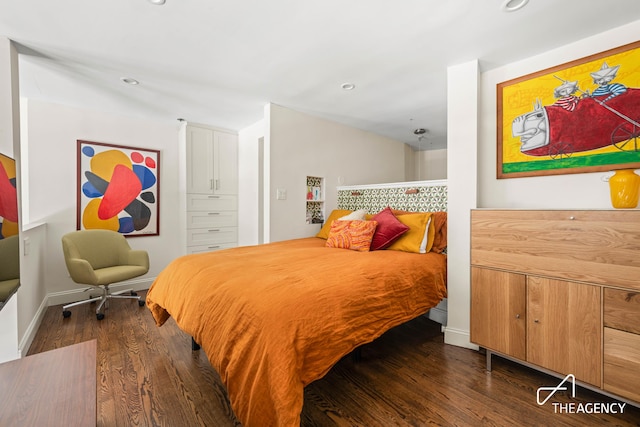 bedroom featuring dark wood-style flooring, recessed lighting, and baseboards