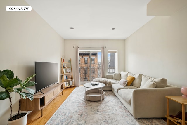 living area with light wood-type flooring and visible vents