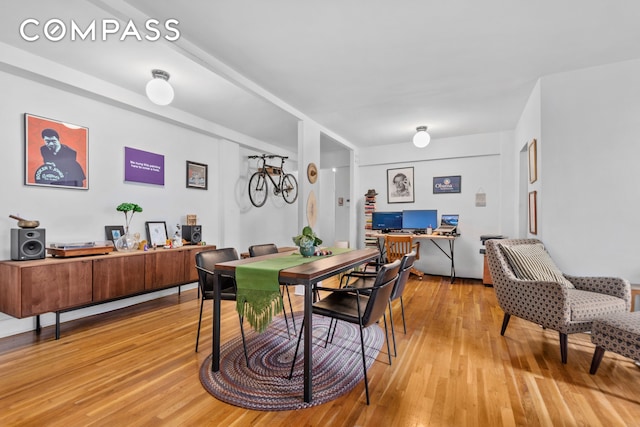 dining space with light wood-style flooring