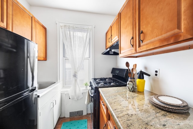 kitchen featuring sink and black appliances