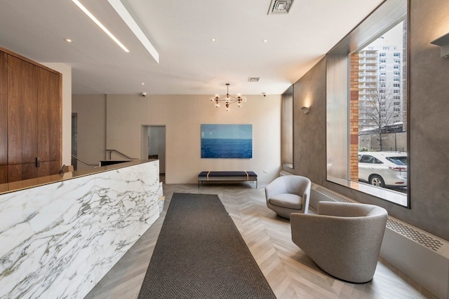 reception area featuring an inviting chandelier