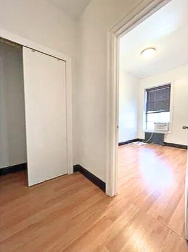interior space with light wood-style flooring and baseboards