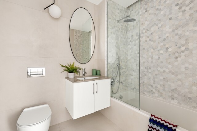 450 Grand Ave Unit 4A, New York City, NY 11238 - full bath featuring bathtub / shower combination, toilet, vanity, and tile patterned flooring