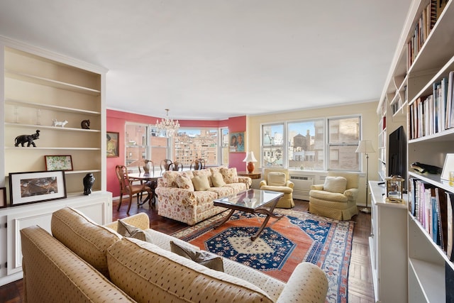 living room with parquet floors and a chandelier