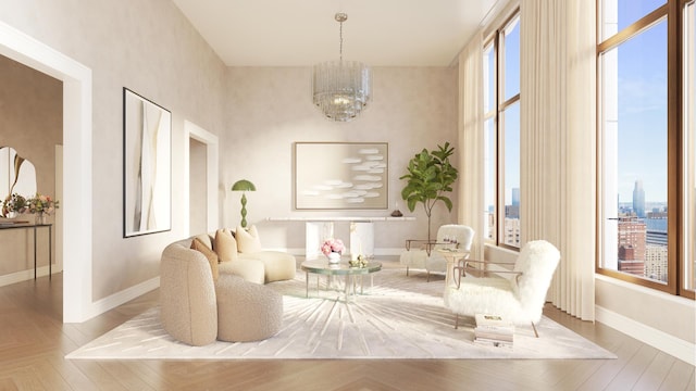 sitting room with a wealth of natural light, baseboards, an inviting chandelier, and wood finished floors