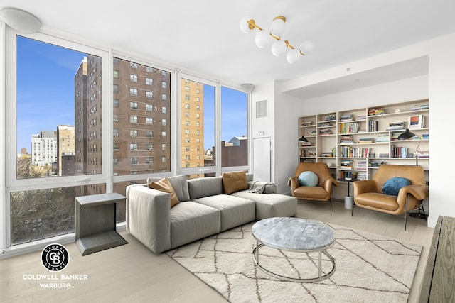 1399 Park Ave Unit 8D, New York City, NY 10029 - living room with wood finished floors and a view of city