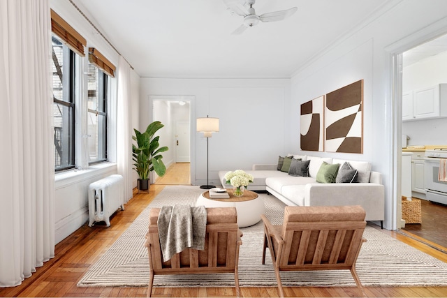 living area featuring radiator and ceiling fan