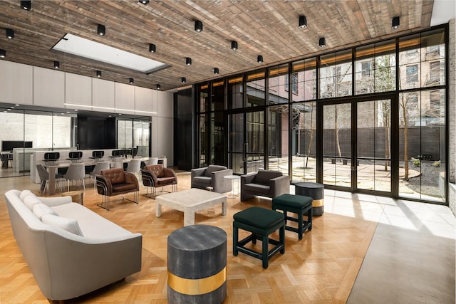 959 1st Ave Unit 15D, New York City, NY 10022 - common area with a high ceiling, floor to ceiling windows, and wood ceiling