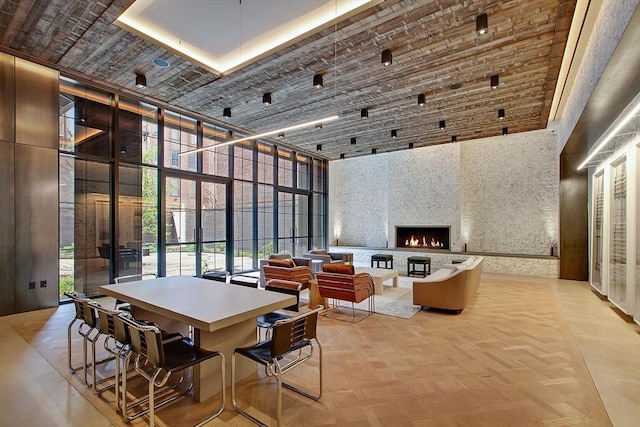 959 1st Ave Unit 15D, New York City, NY 10022 - dining room with a towering ceiling, plenty of natural light, and a fireplace
