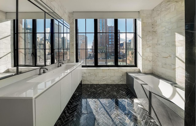 bathroom with a relaxing tiled tub