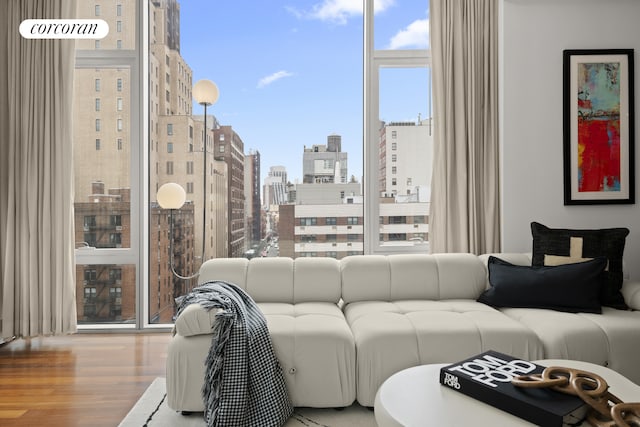 living room with wood finished floors and a city view