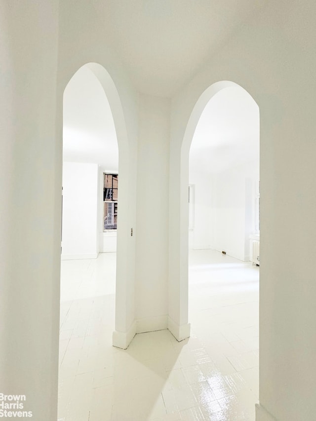 hall with arched walkways