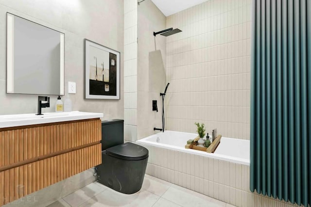 bathroom featuring vanity, tiled shower / bath combo, tile walls, toilet, and tile patterned floors