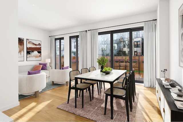 dining room with light wood-style flooring