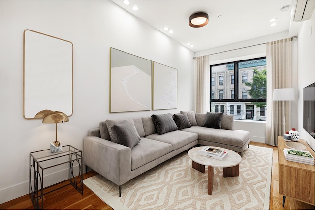 479 Lexington Ave Unit 3A, New York City, NY 11221 - living room featuring baseboards, wood finished floors, and recessed lighting