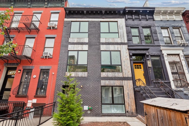 479 Lexington Ave Unit 3A, New York City, NY 11221 - full bathroom featuring a washtub, tile walls, toilet, and walk in shower