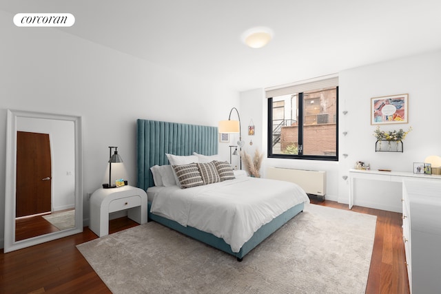 50 W 15th St Unit 2E, New York City, NY 10011 - bedroom with radiator and wood finished floors