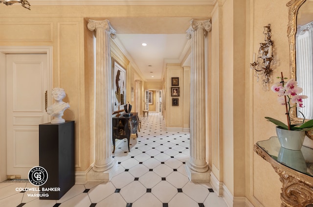 hallway featuring crown molding and ornate columns