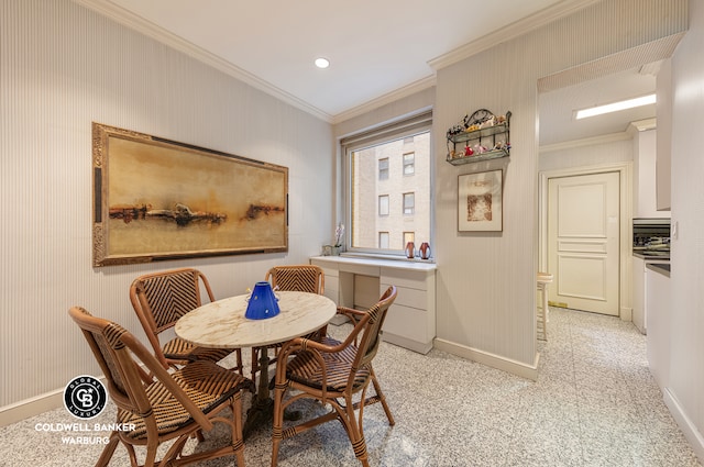 dining space featuring baseboards, ornamental molding, and recessed lighting