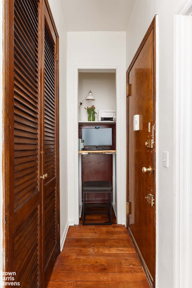 hallway featuring wood finished floors