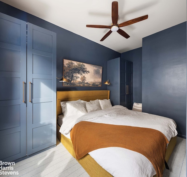 bedroom with ceiling fan and light wood-type flooring