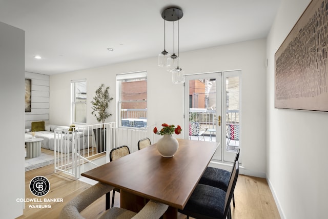 dining space with light hardwood / wood-style flooring