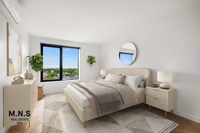 22-54 46th St Unit 201, New York City, NY 11105 - bedroom with a wall unit AC and baseboards