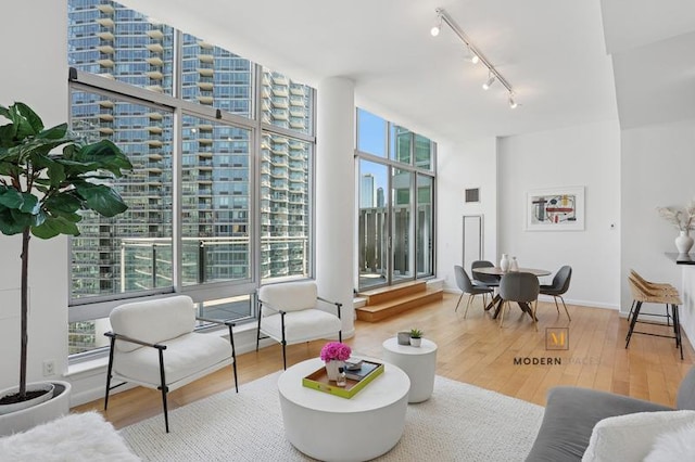 46-30 Center Blvd Unit Ph-3, New York City, NY 11109 - living area with track lighting, wood finished floors, and a city view